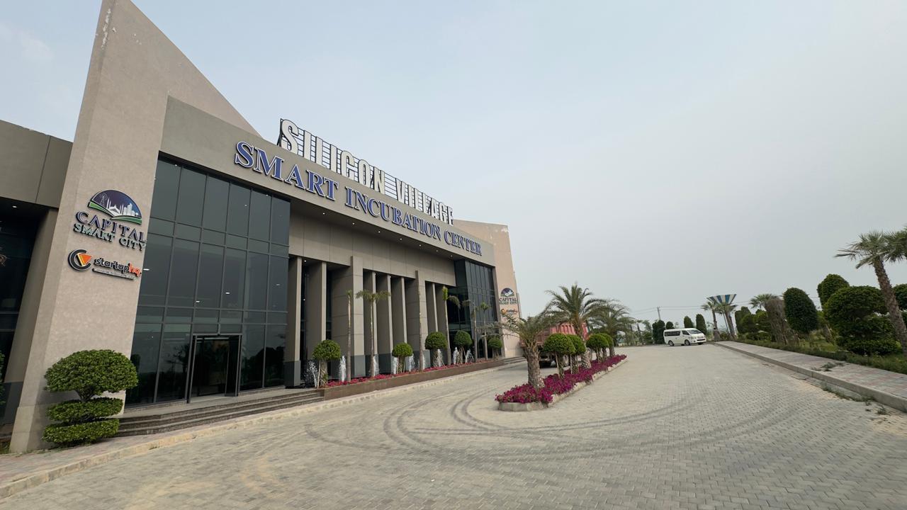 Building exterior of Silicon Village Smart City Capital with signage reading Silicon Village Smart Incubation Center on top