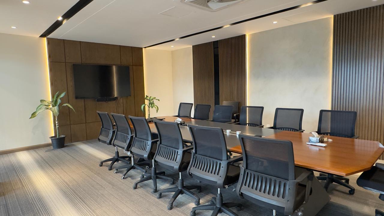 Wide view of meeting room at Silicon Village Smart City Capital showing modern conference table and workspace environment